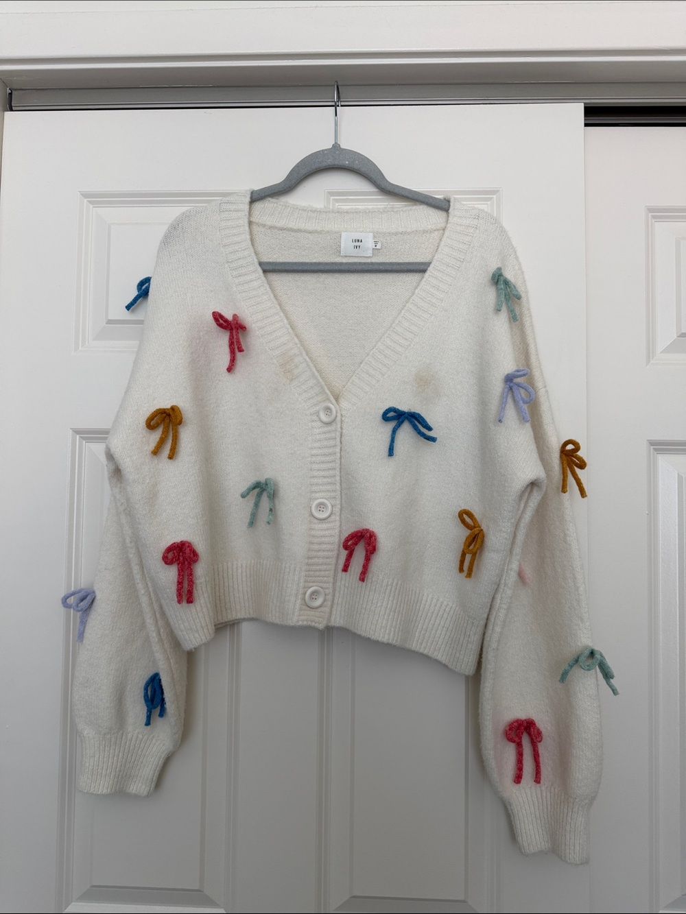Ivory Cropped V-Neck Cardigan with Multicolor Bow Accents